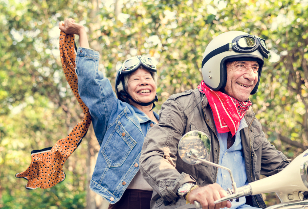 Retired couple having fun on a motorcycle