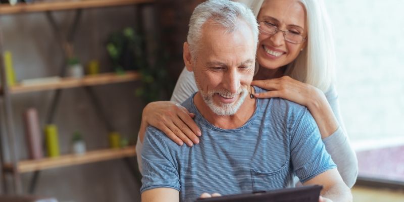 Retired couple reviewing financial portfolio