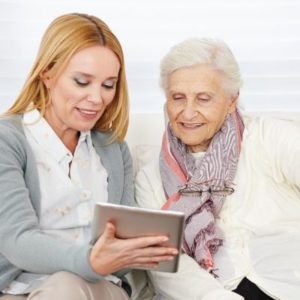 Advisor helping a client on a tablet