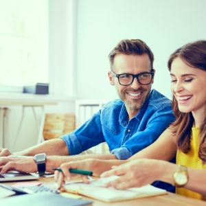 Happy couple doing taxes