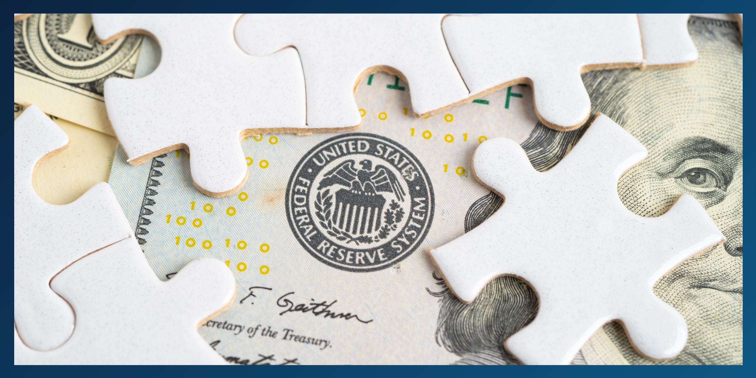 Picture of 100 dollar bill and puzzle pieces