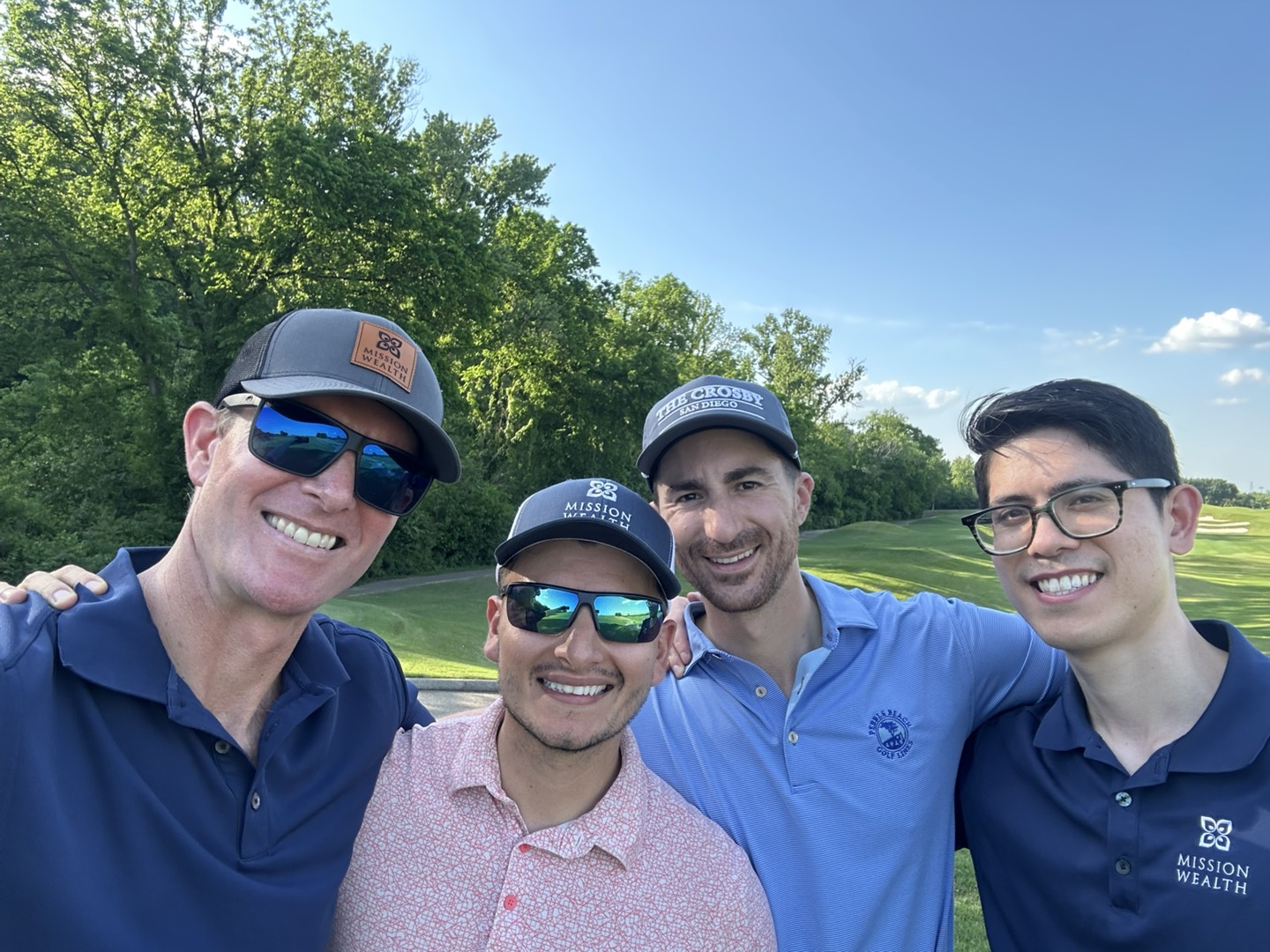 Kieran Osborne takes a group selfie with Mission Wealth colleagues during a golf outing.
