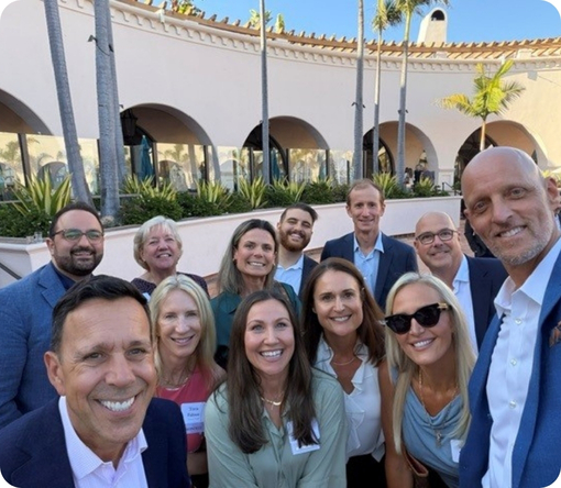 Group photo of Jeff Avila and colleagues at a networking event, showcasing camaraderie and professional connections at Mission Wealth.