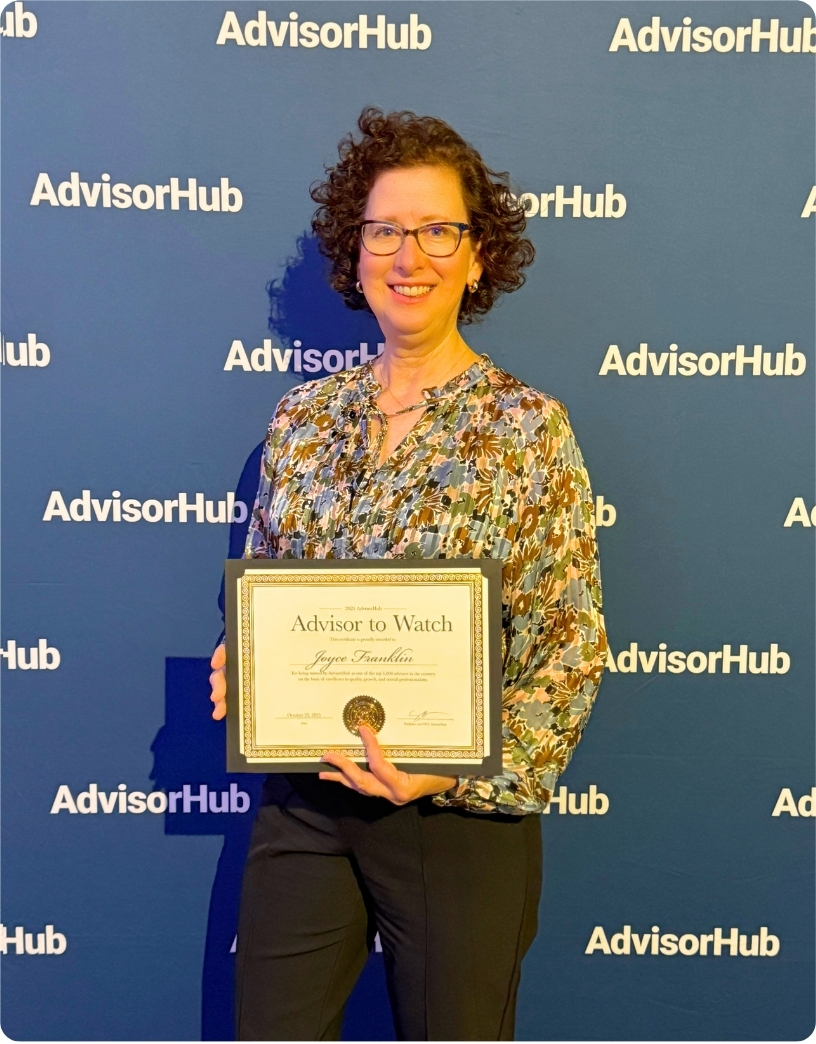 Joyce L. Franklin holds her "Advisor to Watch" award against an AdvisorHub backdrop.