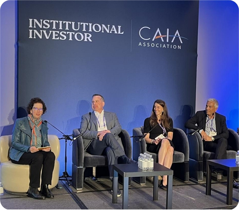 Panel discussion featuring four speakers at an Institutional Investor and CAIA Association event.