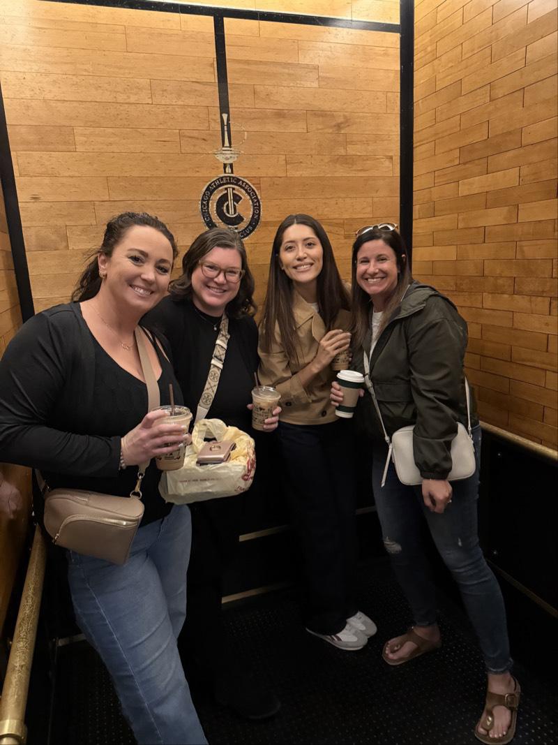 Tina Kunze poses with Mission Wealth colleagues during a team outing.