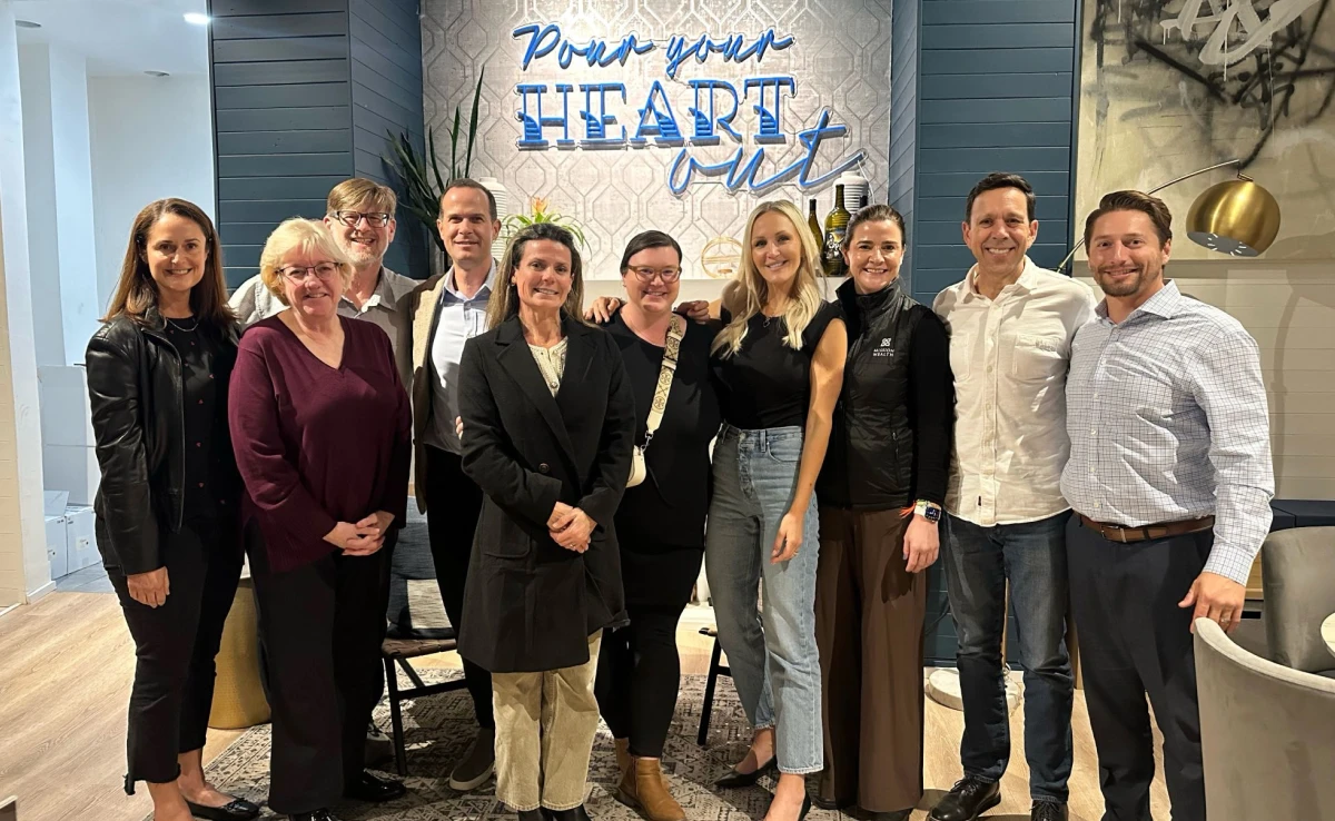Michelle Winkles with colleagues at a wealth management team event